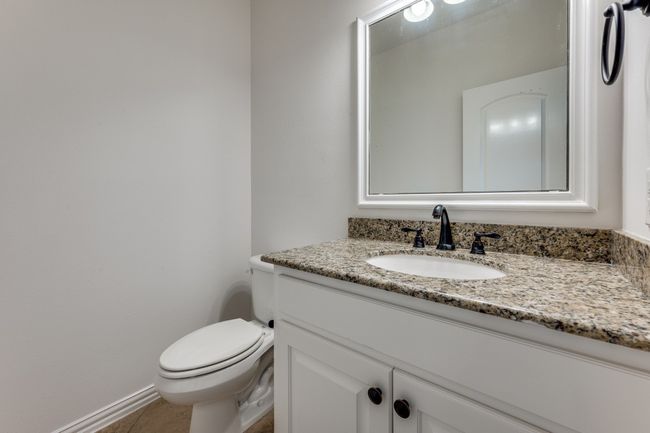 Bathroom featuring toilet and vanity | Image 23