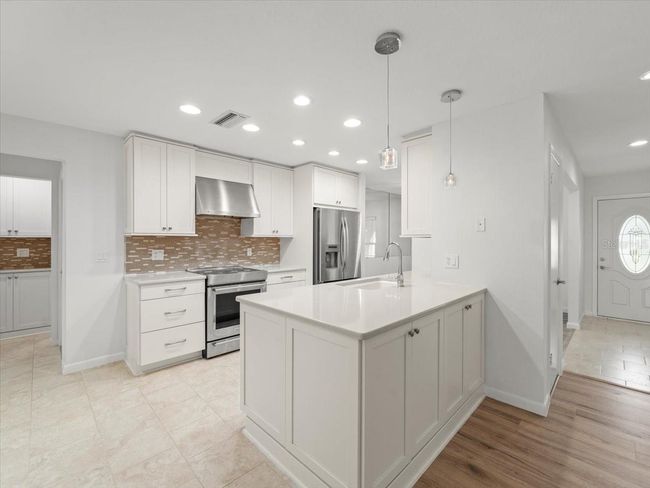 4016 Windtree Dr, House other with 4 bedrooms, 2 bathrooms and null parking in Tampa FL | Image 4