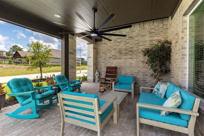 Charming front porch with cozy seating. | Image 12