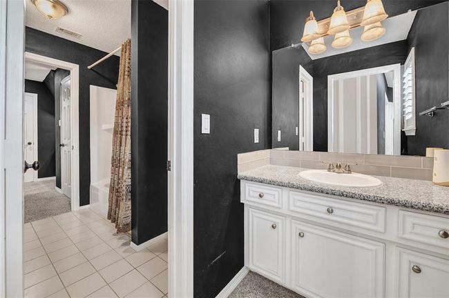 One of two secondary bathrooms upstairs, shared Jack and Jill setup. | Image 24