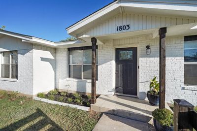 Entrance to property with a porch | Image 1