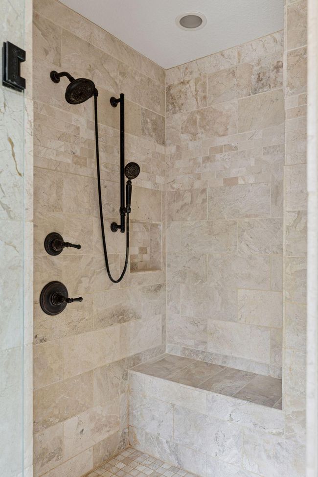 Walk in shower has a heated bench and double shower heads. | Image 19