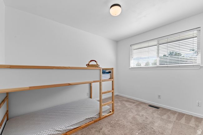 Bedroom featuring carpet and baseboards | Image 11