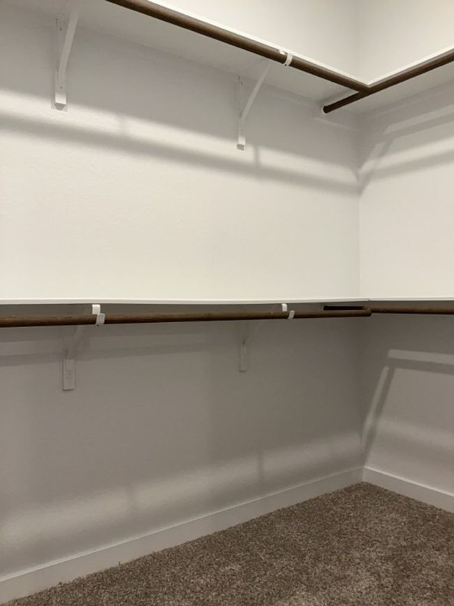 Walk in closet with carpet flooring | Image 21