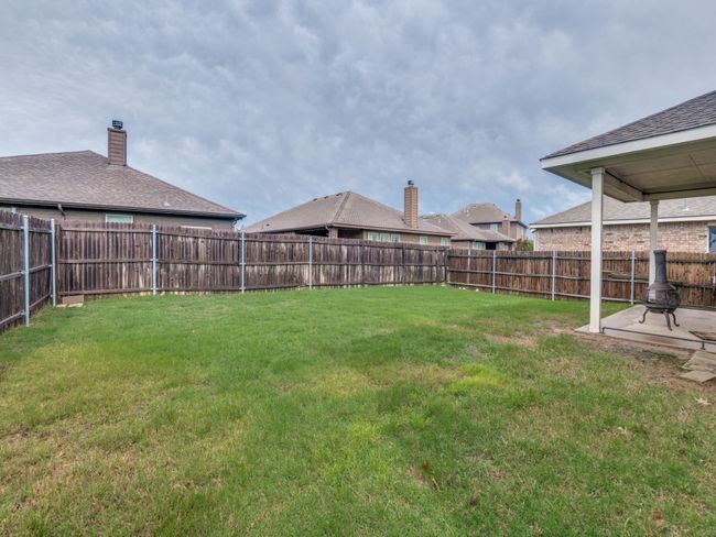 View of yard featuring a fenced backyard | Image 24