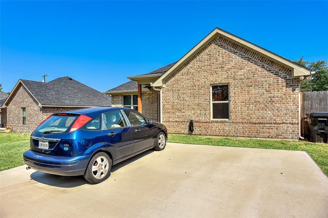 View of home's exterior with brick siding | Image 9