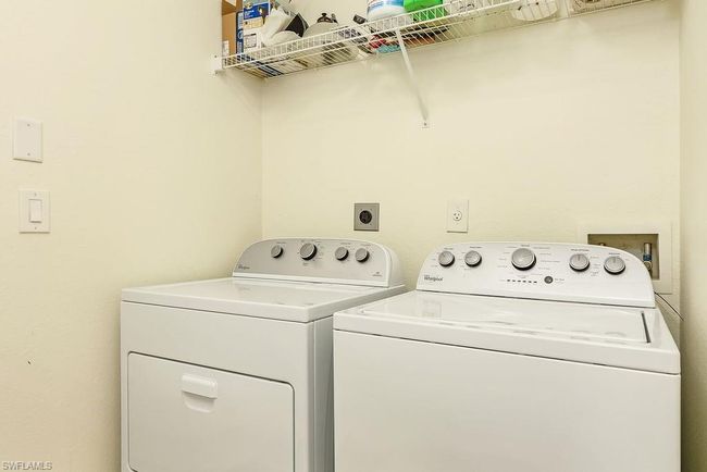Washroom with washing machine and dryer and laundry area | Image 26
