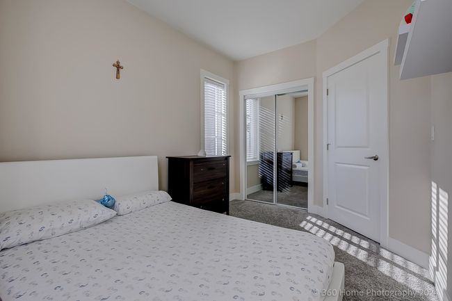 Carpeted bedroom featuring baseboards and a closet | Image 11