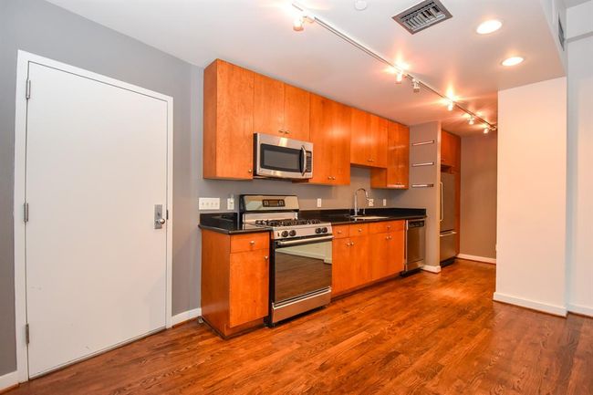 Closer look at the kitchen area. | Image 17