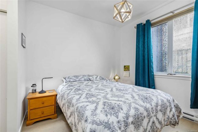 Bedroom featuring a baseboard radiator | Image 19