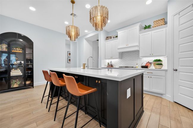 This stunning kitchen showcases a large quartz island ideal for meal prep, casual dining, or entertaining. Thoughtfully designed with ample storage and clean, modern lines, this space is both beautiful and highly functional — perfect for daily living or hosting in style. | Image 12