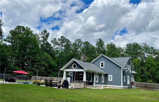 View of the backyard with outdoor patio and fireplace | Image 40