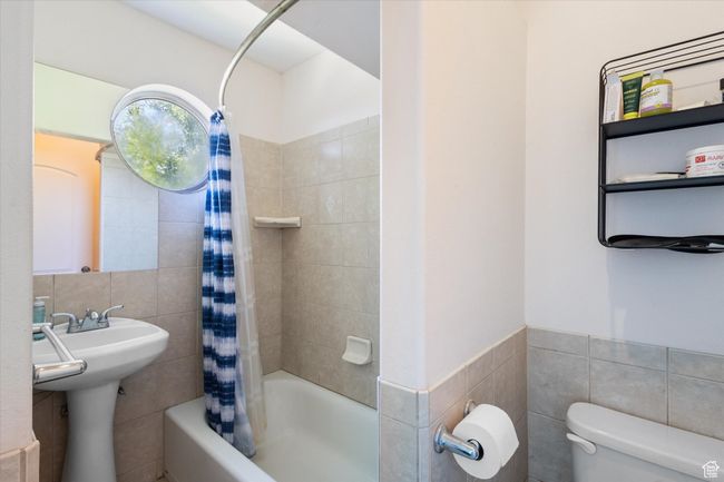 Full bath with tile walls and shower / bath combo | Image 22