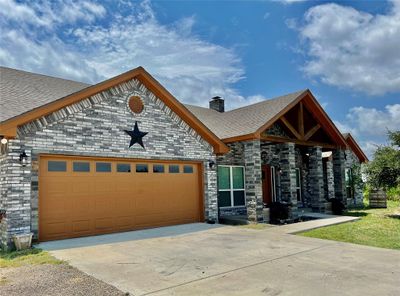 View of front of property featuring a garage | Image 1