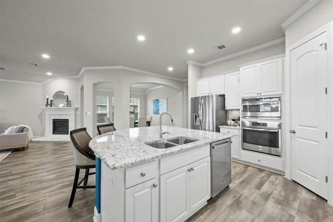 The modern design blends style and functionality, making this kitchen the heart of the home. | Image 15