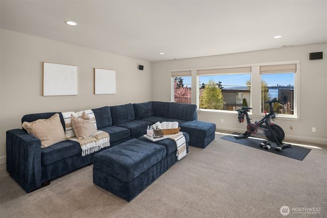 A flexible bonus room with built-ins and a wet bar invites creativity as a media lounge, office or play space. | Image 30