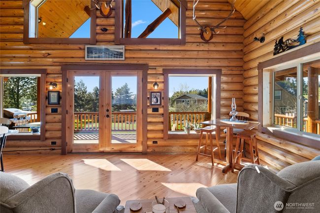 Craftmanship to be in awe of from the hand cut logs to the millwork around windows and doors as well as the tongue and groove ceiling. | Image 11