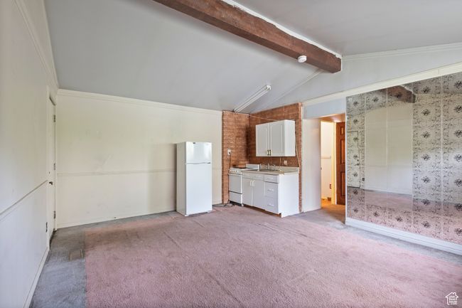 2nd Kitchen featuring white appliances, light carpet, light countertops, and white cabinetry | Image 26