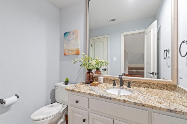 Bathroom featuring toilet and vanity | Image 20