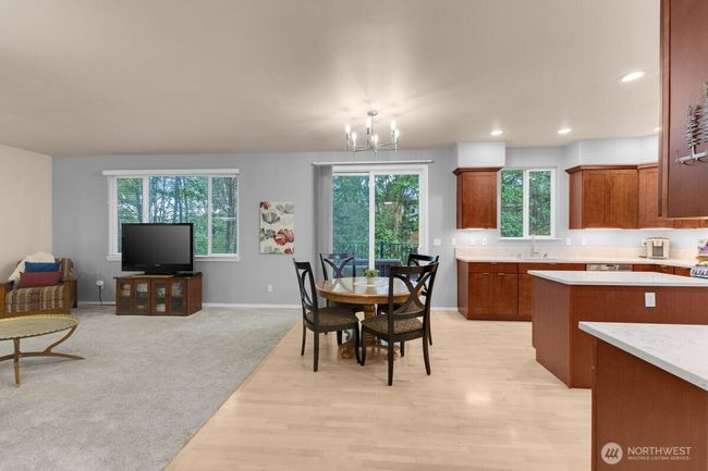 View into kitchen - open and bright with lots of windows | Image 5