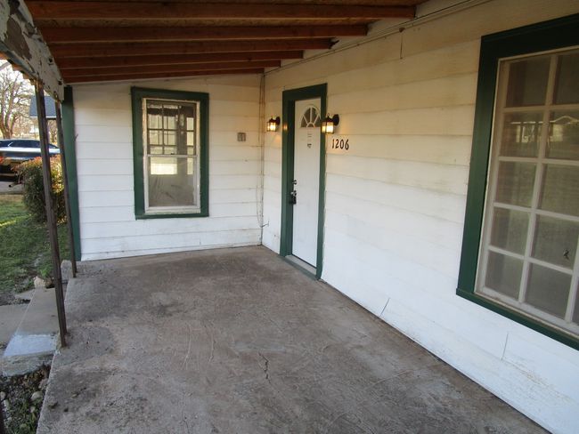 Doorway to property with covered porch | Image 9