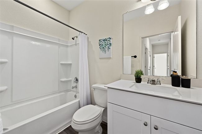Full bath with shower / bath combination with curtain, toilet, vanity, and wood finished floors | Image 31