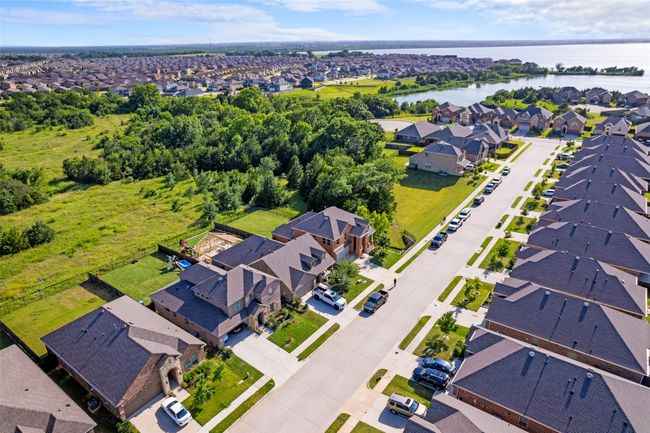Aerial view of property and surrounding area featuring nearby suburban area and a large body of water | Image 36