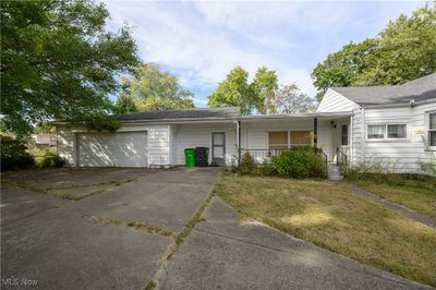 Single story home with a front yard, a garage, and covered porch | Image 3