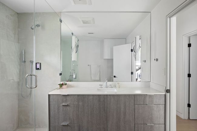 Bathroom featuring vanity and a stall shower | Image 20