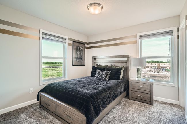 Photo is of the model. The third secondary bedroom that comes perfectly sized with a spacious closet. | Image 18