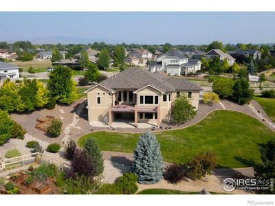 This home is situated on a .68 acre corner lot and features well thought out landscape design with an abundant mix of deciduous and evergreen trees and shrubs. | Image 3