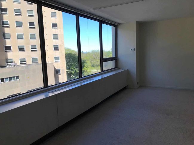 View from Living room to bedroom with divider open | Image 8