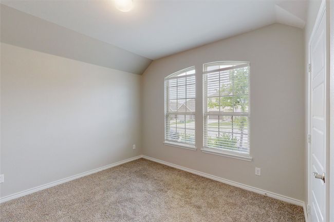 Spare room with lofted ceiling, a healthy amount of sunlight, carpet flooring, and baseboards | Image 21