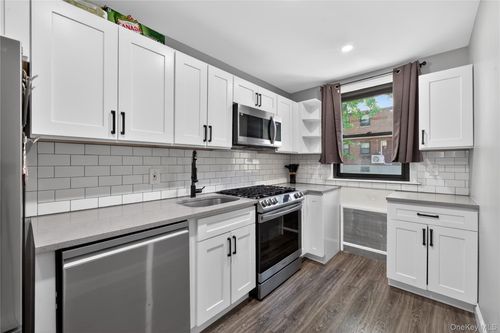 upper-56-21 Douglastion Parkway, New York, NY, 11362 | Card Image