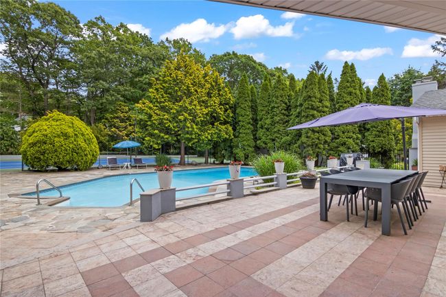 Swimming pool with a patio and outdoor dining space | Image 34