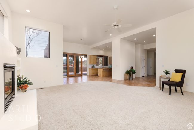 Living area with recessed lighting, ceiling fan, and light colored carpet | Image 15