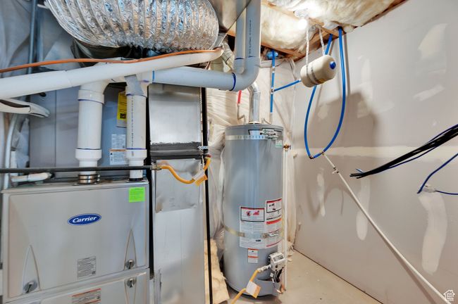 Utilities featuring strapped water heater | Image 25