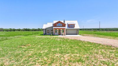 View of front of house with a garage and a front lawn | Image 3