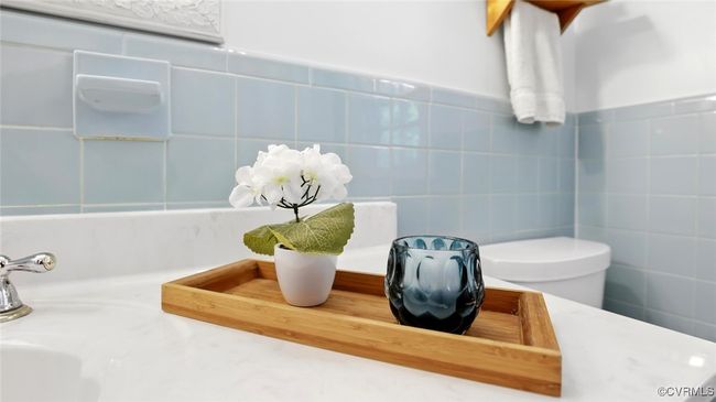 Bathroom featuring tile walls and toilet | Image 18