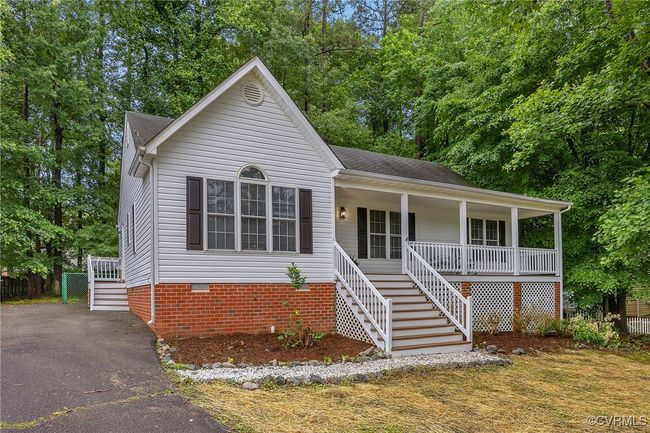 View of front of property with stairs, a porch, crawl space, and asphalt driveway | Image 29