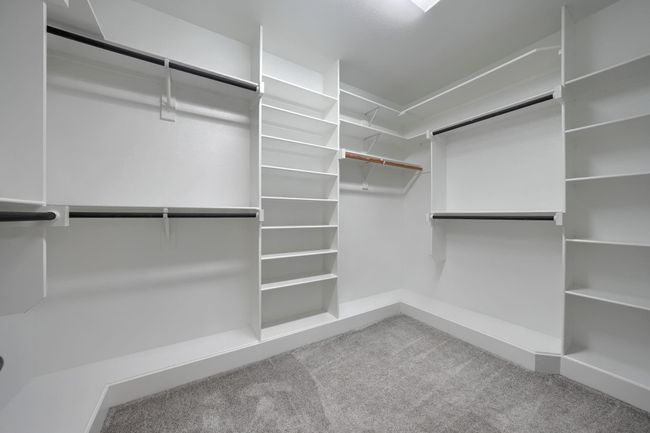 Spacious closet with carpet flooring | Image 22