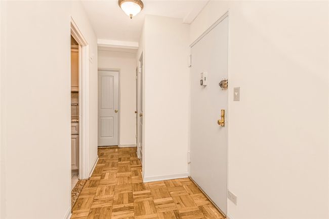 Spare room with baseboards and baseboard heating | Image 11