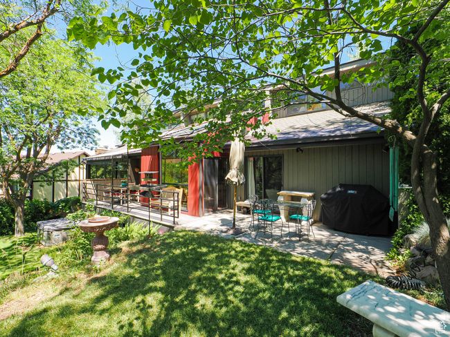 Back of house with a patio area and a yard | Image 62