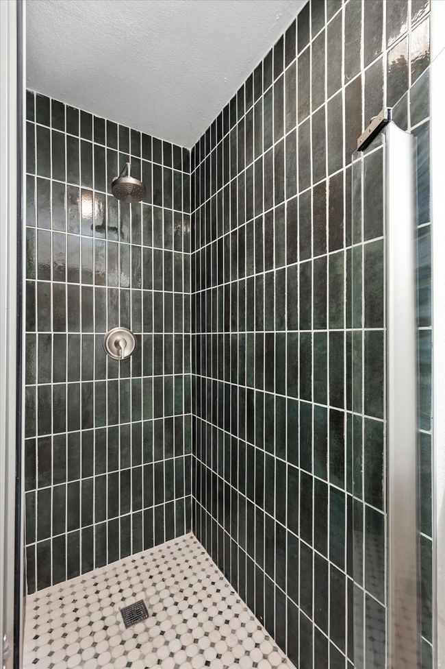 Full bath featuring a tile shower | Image 15