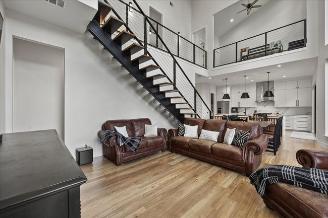 Beautiful family room complete with impressive staircase | Image 8
