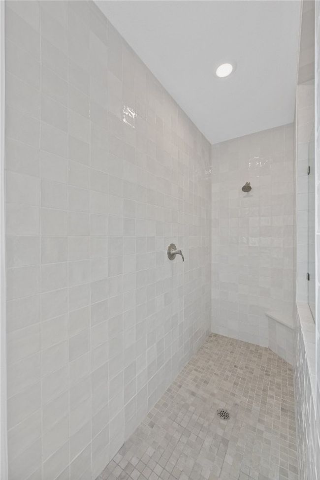 Bathroom with a tile shower and recessed lighting | Image 16
