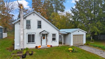 Welcome to 173 Grant Rd! You feel the country charm as soon as you arrive in the paved driveway and enter in the side door into the foyer. | Image 1