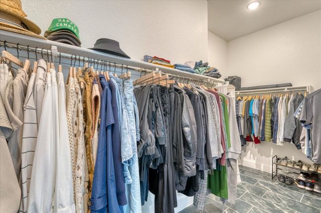Walk in closet featuring marble finish flooring | Image 22