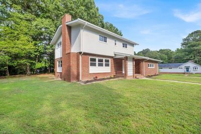 Traditional on Corner Lot with 2 Car Side Load Garage | Image 1