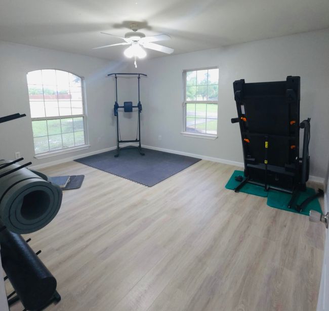 Bedroom 5, Workout room with wood finished floors, plenty of natural light, and ceiling fan | Image 28